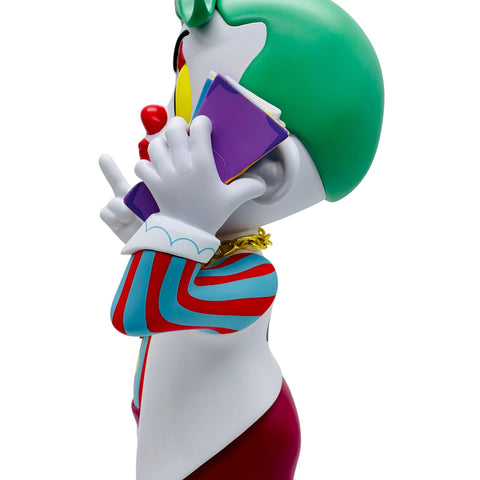 RedGuardian vinyl figure of a clown with green hair holding a phone to his ear and a purple book. Limited edition.