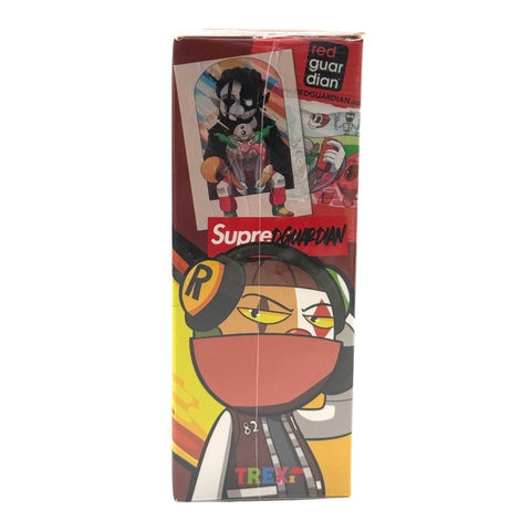 RedGuardian x Trexii collaboration vinyl toy box featuring a cartoon character with headphones and a mask, vibrant colors, and urban art.