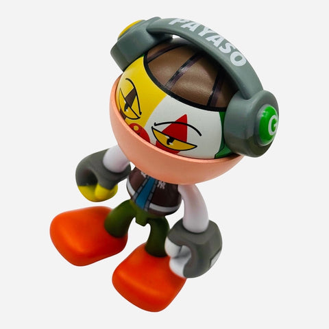 RedGuardian x Trexii Payaso vinyl toy with headphones, featuring a colorful clown-like face and orange feet.