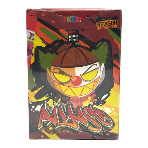 RedGuardian x Trexii collaboration vinyl toy box featuring a clown character with yellow eyes and a wide grin, graffiti art, and bold colors.
